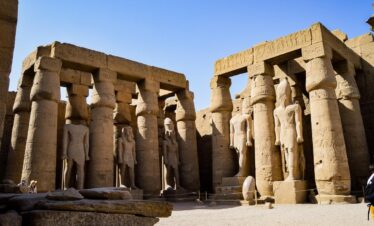 Stone columns and statues at Luxor Temple in Egypt