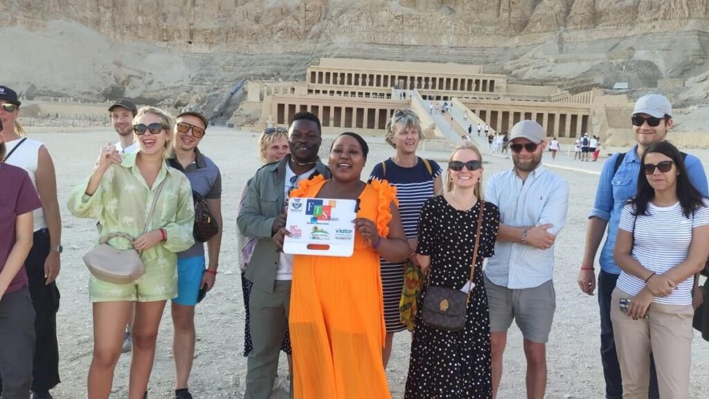 Tourists smiling in front of Hatshepsut Temple