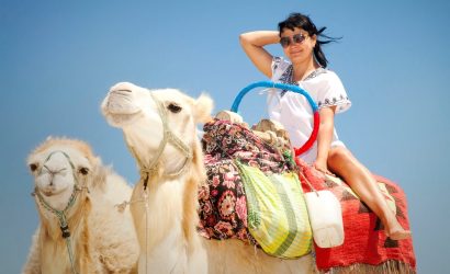 young female tourist in tunic and sunglasses poses 2025 03 19 17 42 18 utc