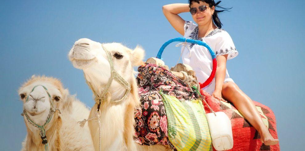 young female tourist in tunic and sunglasses poses 2025 03 19 17 42 18 utc